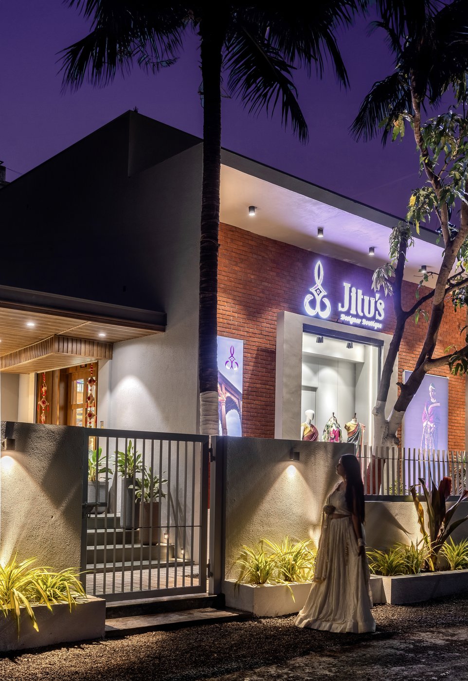 Jitu's Boutique storefront at dusk