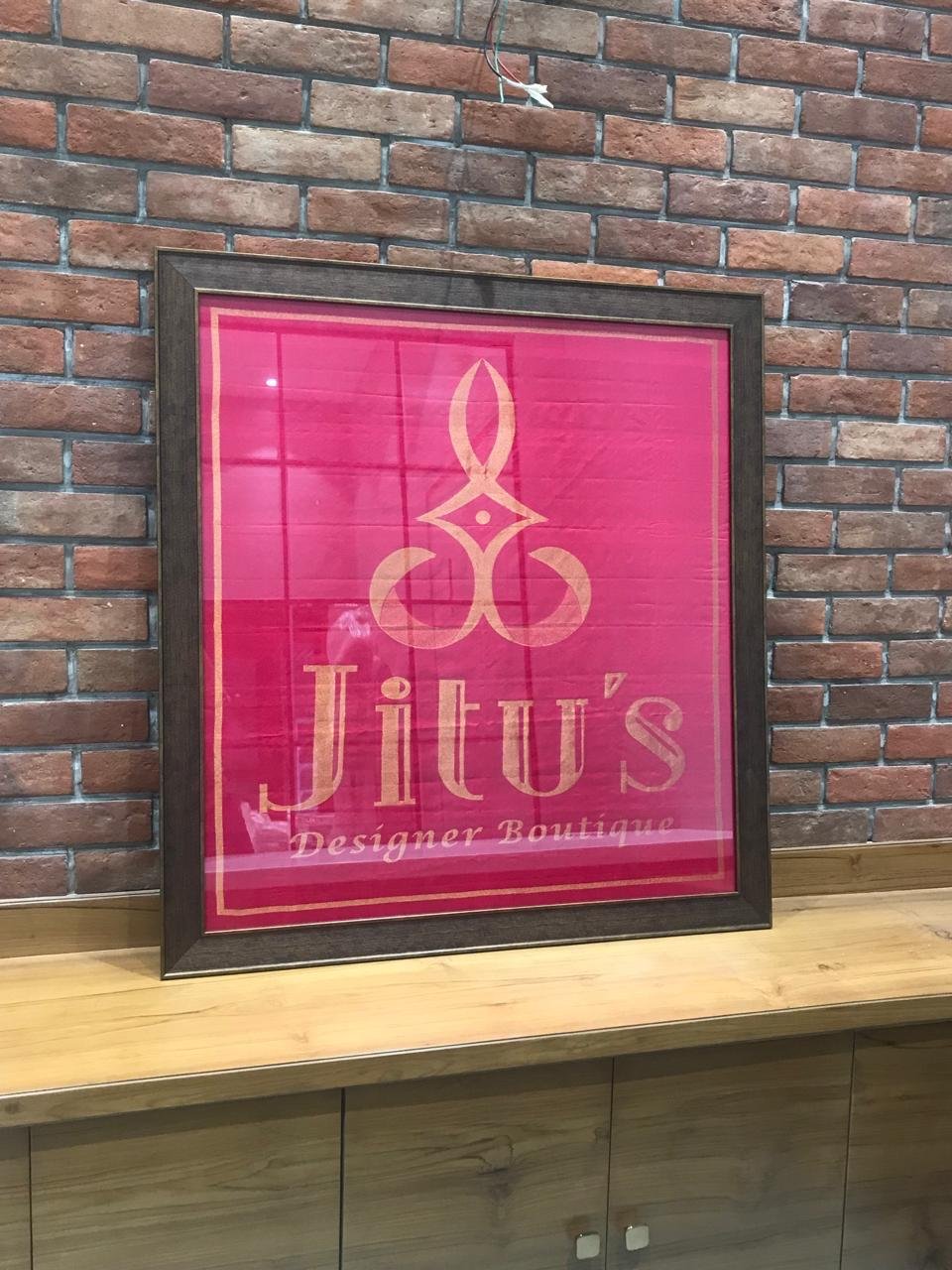 Jitu's Boutique backlit signage