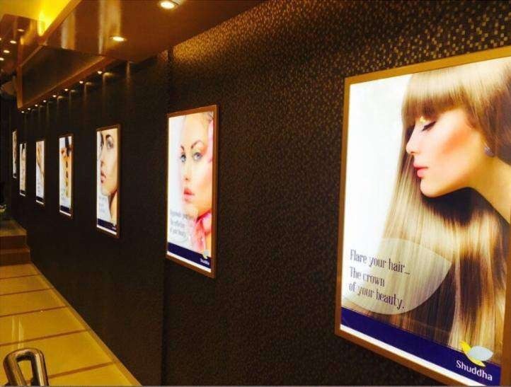 Shuddha Wellness interior corridor with branded light boxes